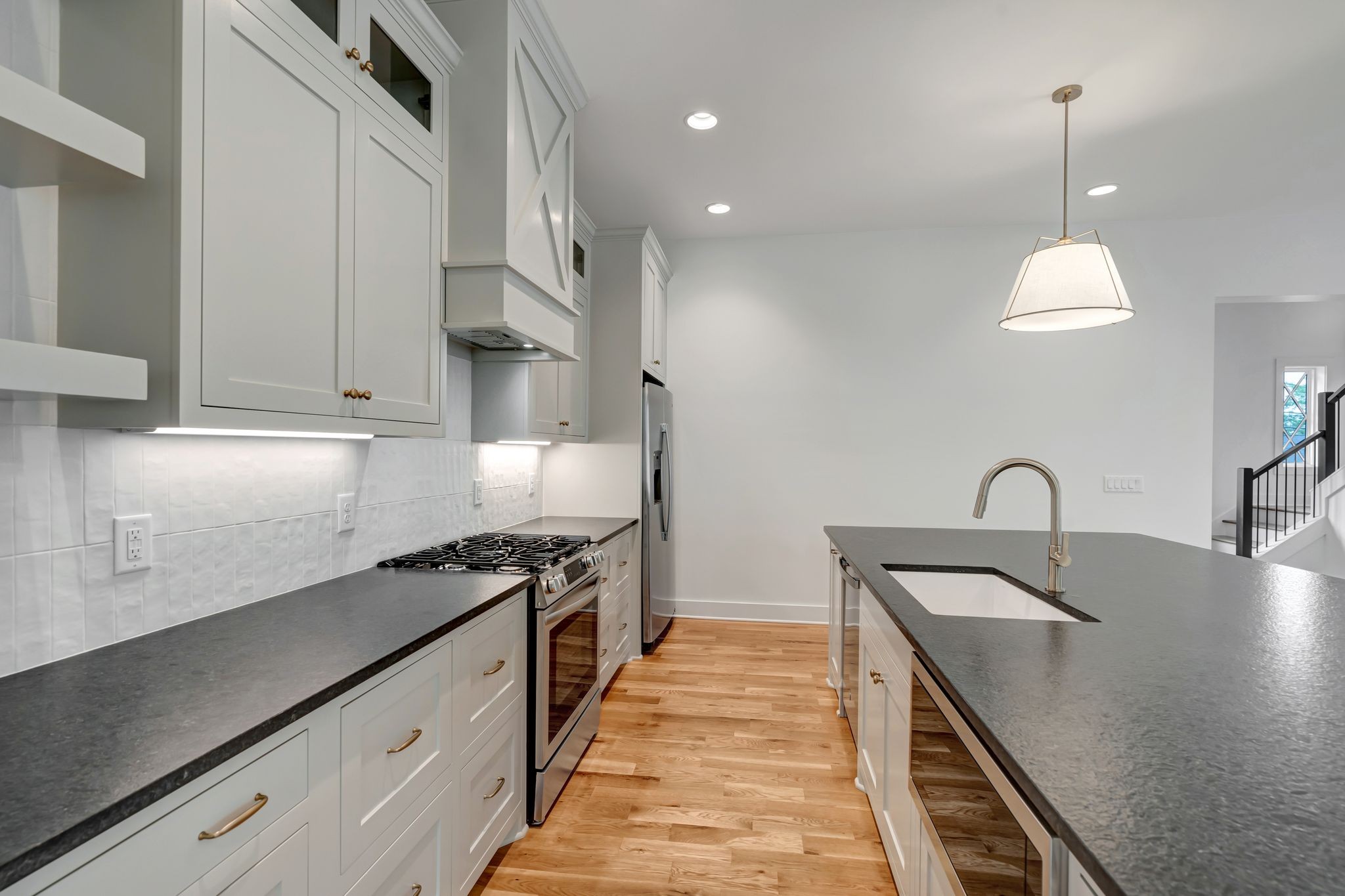 1826 Cephas Street Nashville, TN 37208 - Photo 15 of 35 a kitchen with kitchen island a sink stove and cabinets