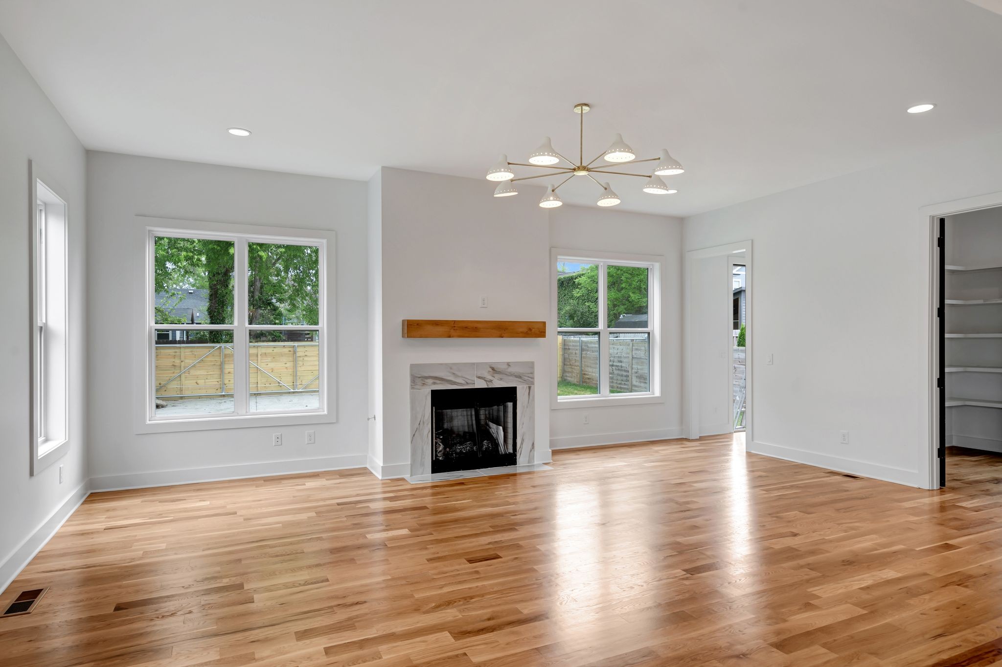 1826 Cephas Street Nashville, TN 37208 - Photo 18 of 35 wooden floor in an empty room with a fireplace
