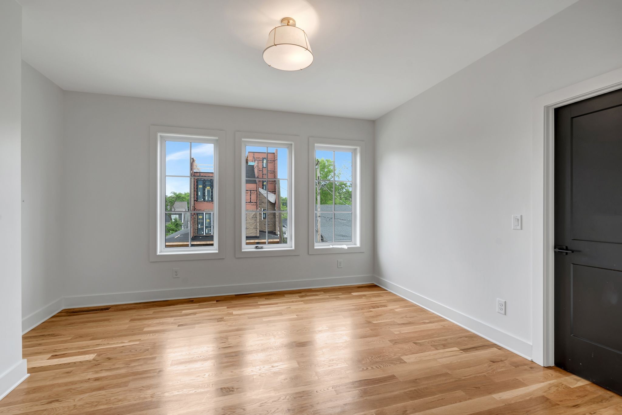 1826 Cephas Street Nashville, TN 37208 - Photo 21 of 35 an empty room with wooden floor and windows