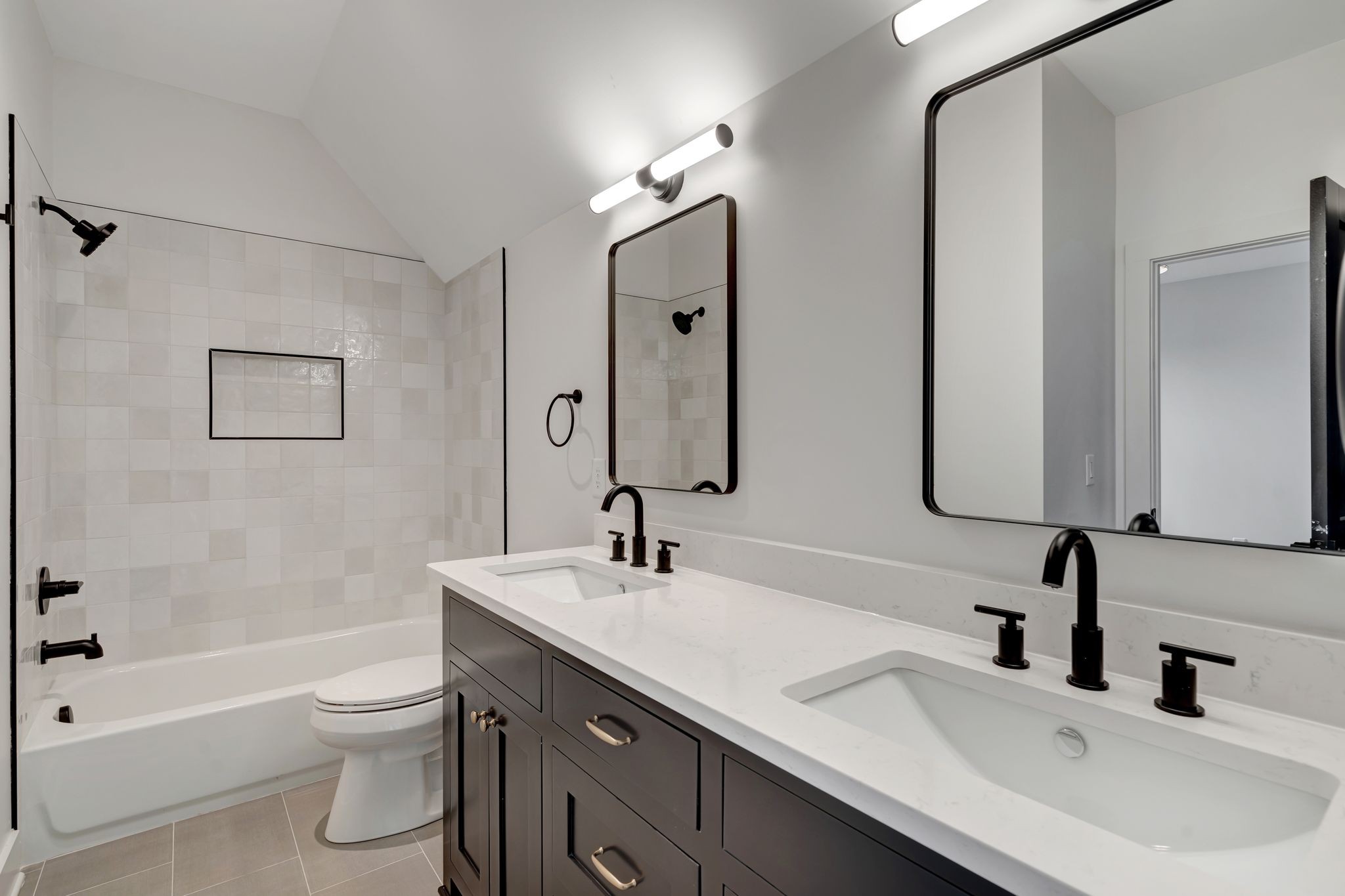 1826 Cephas Street Nashville, TN 37208 - Photo 23 of 35 a bathroom with a double vanity sink toilet mirror and bathtub
