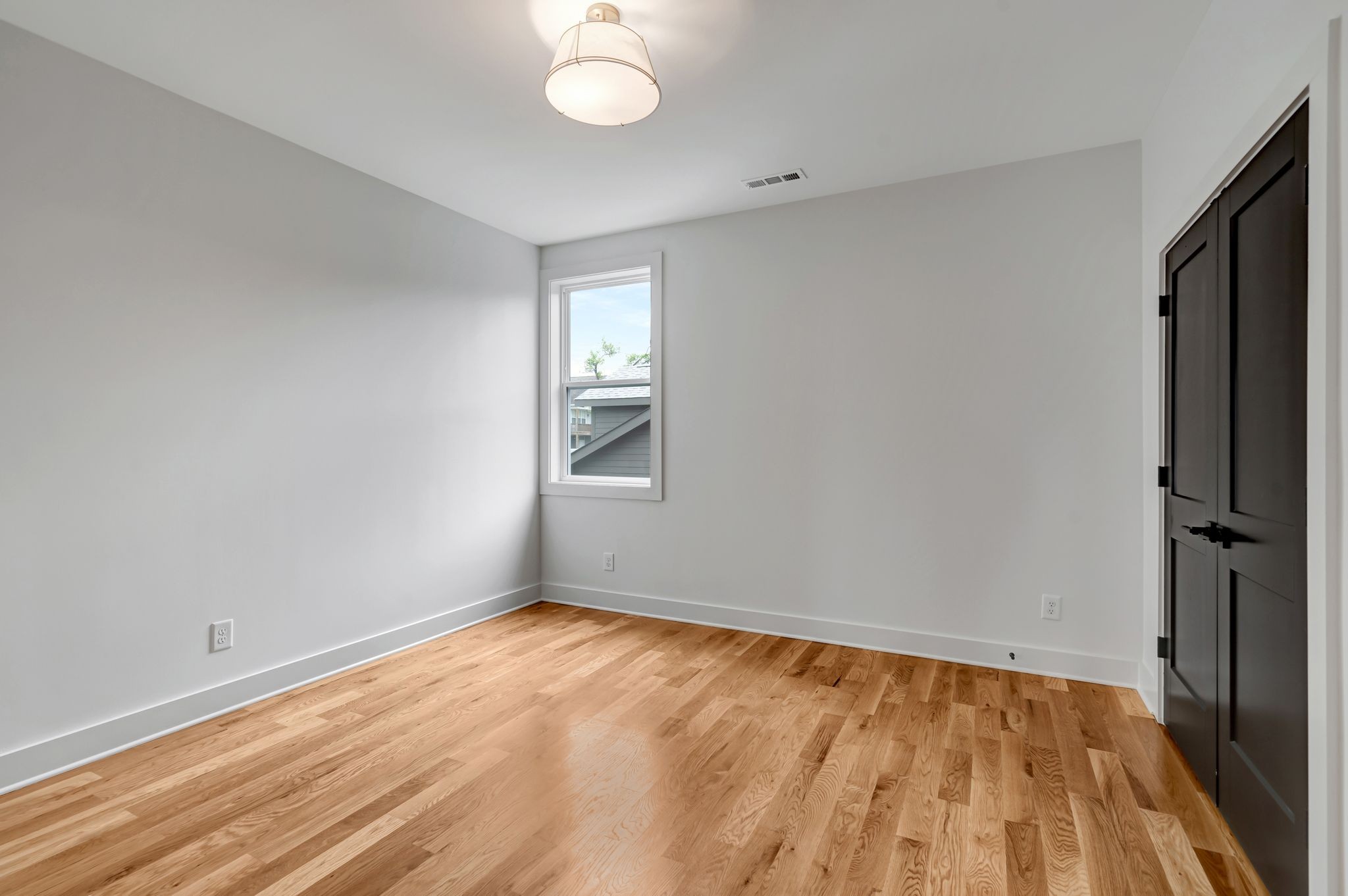 1826 Cephas Street Nashville, TN 37208 - Photo 24 of 35 wooden floor in an empty room with a window