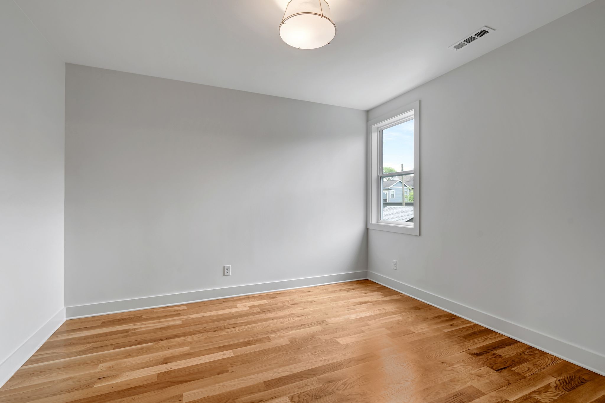 1826 Cephas Street Nashville, TN 37208 - Photo 25 of 35 an empty room with wooden floor and windows