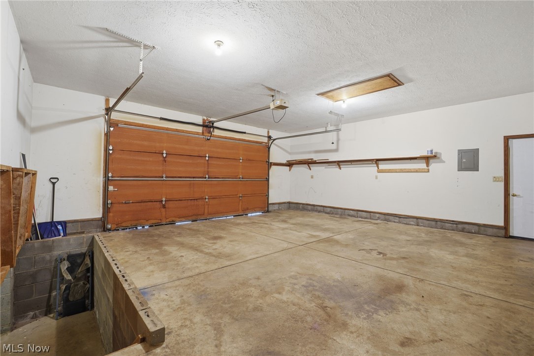 3300 Townline Road Madison, OH 44057 - Photo 25 of 30 Access to crawl space and storage above garage