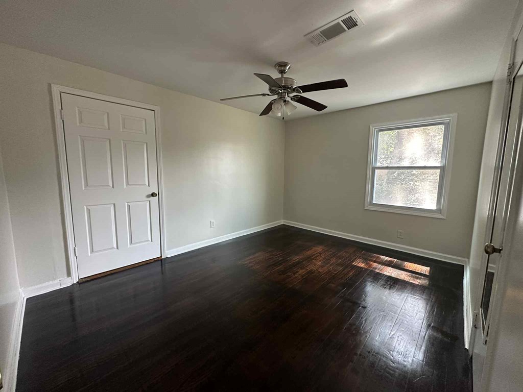 5640 Lakeshore Road Columbus, GA 31907 - Photo 6 of 11 a view of empty room with wooden floor and fan