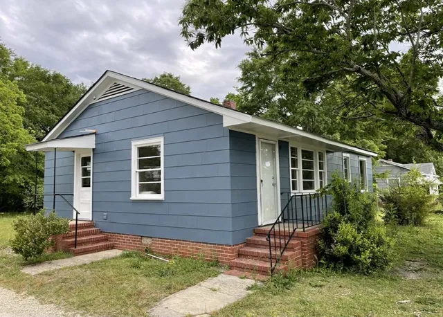 a backyard of a house with lots of green space