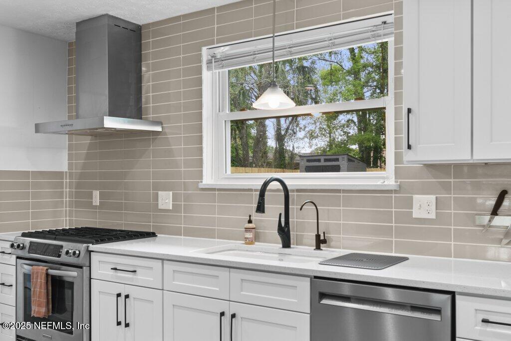 9480 Pickwick Drive Jacksonville, FL 32257 - Photo 15 of 43 a kitchen with appliances a sink and cabinets