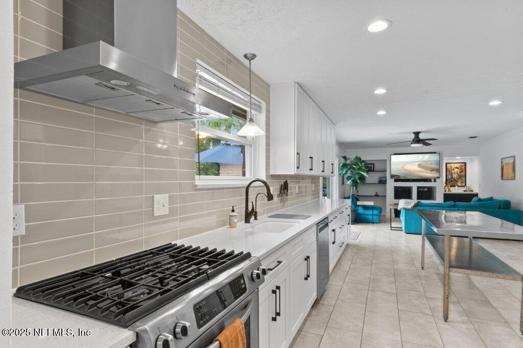 9480 Pickwick Drive Jacksonville, FL 32257 - Photo 16 of 43 a kitchen with sink stove and cabinets