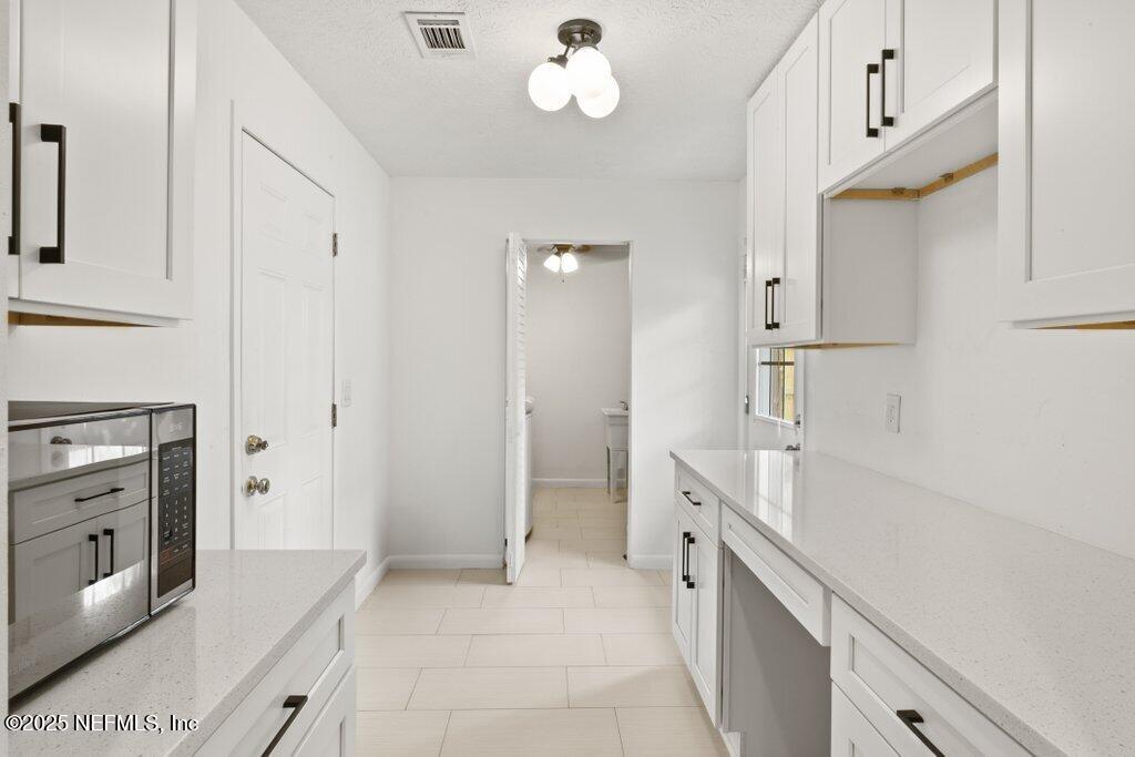 9480 Pickwick Drive Jacksonville, FL 32257 - Photo 19 of 43 a spacious bathroom with a double vanity sink a mirror and a bathtub