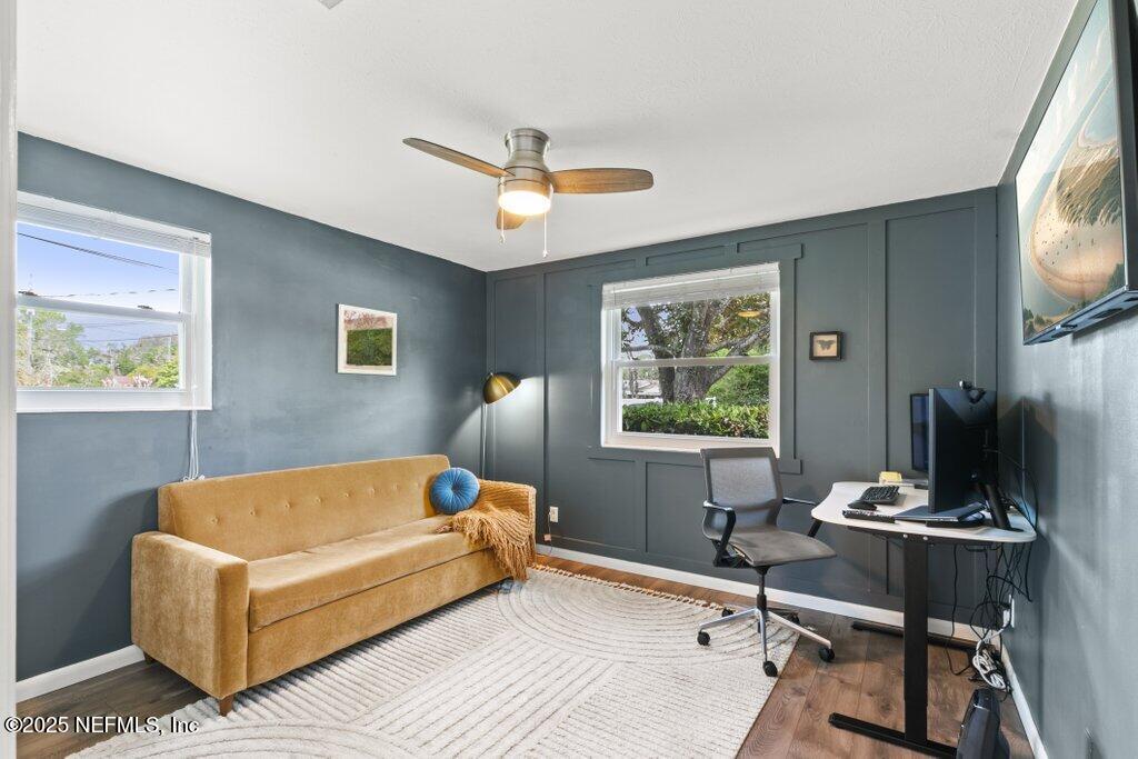 9480 Pickwick Drive Jacksonville, FL 32257 - Photo 25 of 43 a living room with furniture a window and a flat screen tv