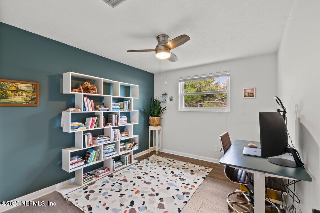 9480 Pickwick Drive Jacksonville, FL 32257 - Photo 27 of 43 a workspace with a bookshelf