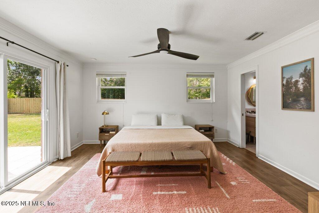 9480 Pickwick Drive Jacksonville, FL 32257 - Photo 29 of 43 a bedroom with a bed and a window