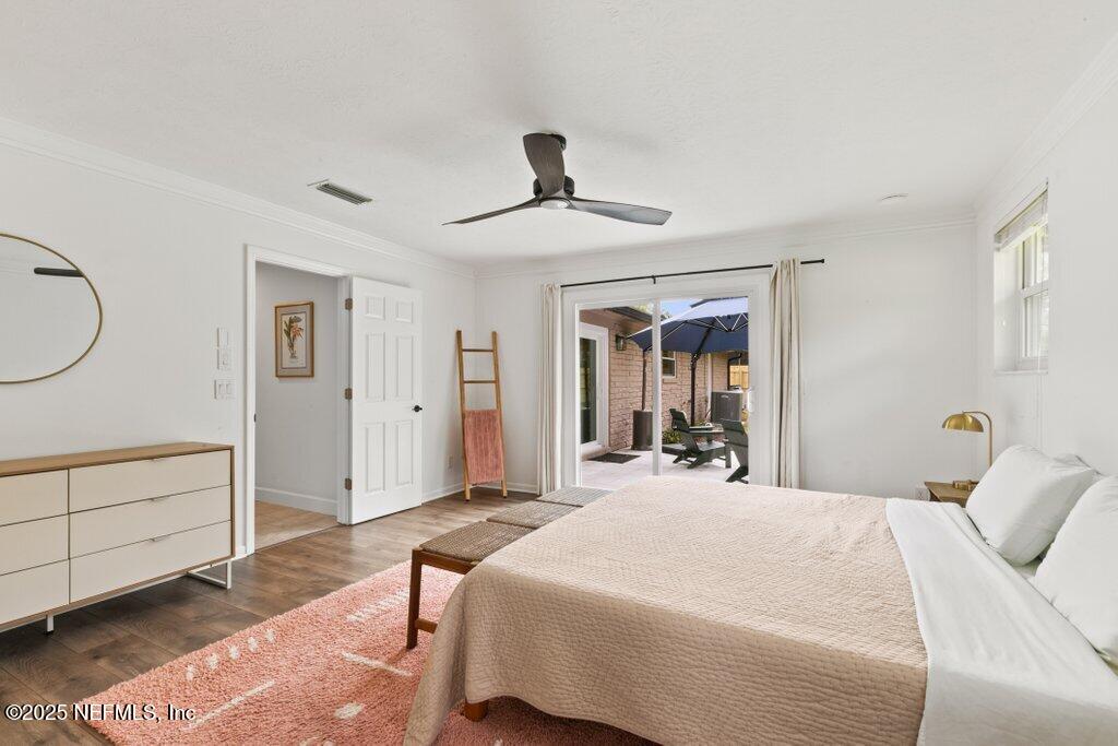 9480 Pickwick Drive Jacksonville, FL 32257 - Photo 32 of 43 a bed room with a bed and a chandelier