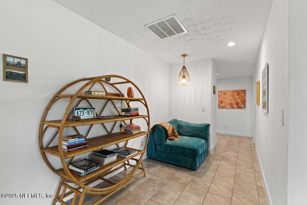 9480 Pickwick Drive Jacksonville, FL 32257 - Photo 5 of 43 a living room with furniture a rug and a window