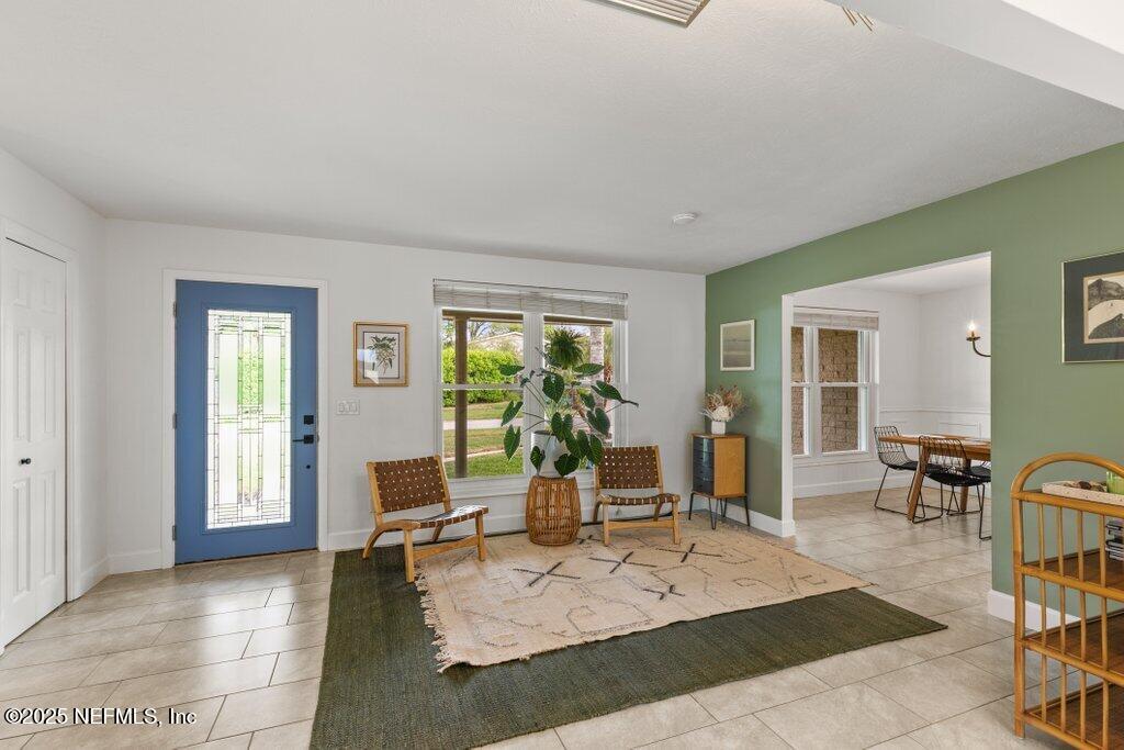 9480 Pickwick Drive Jacksonville, FL 32257 - Photo 6 of 43 a living room with furniture and large window