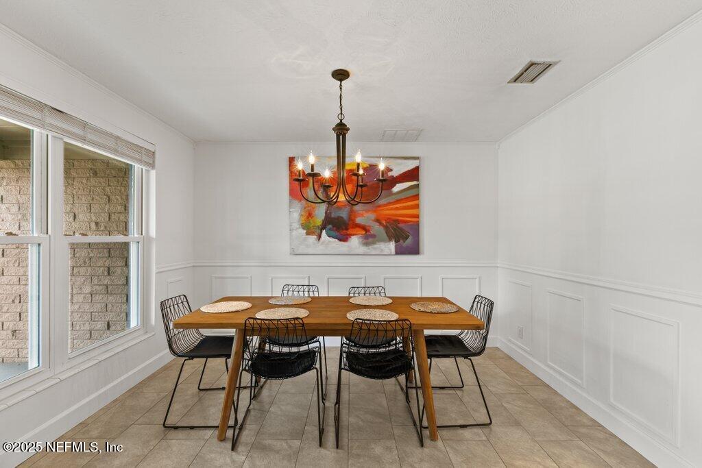 9480 Pickwick Drive Jacksonville, FL 32257 - Photo 7 of 43 a view of a dining room with furniture window and outside view
