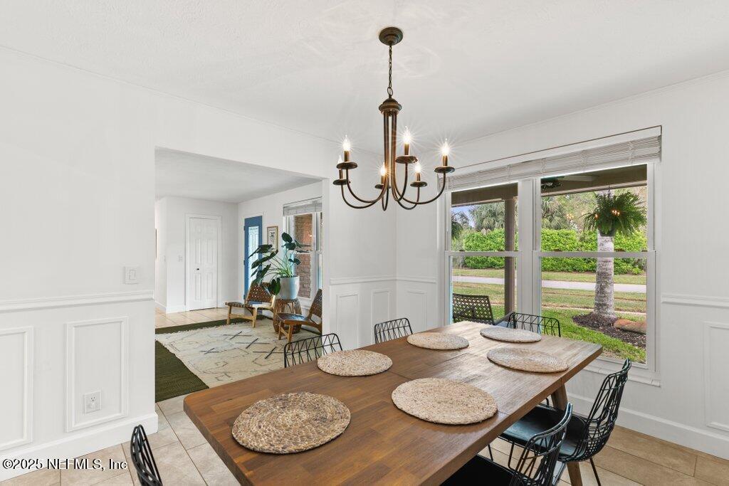 9480 Pickwick Drive Jacksonville, FL 32257 - Photo 8 of 43 a view of a dining room with furniture window and outside view
