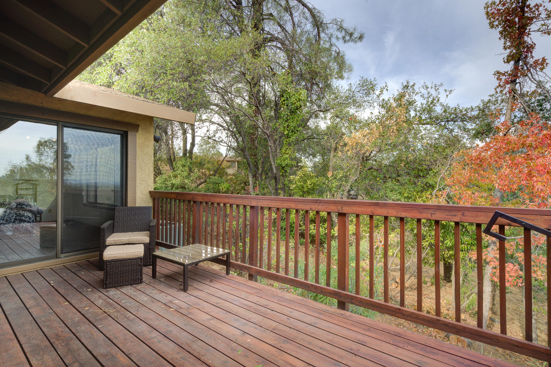 8594 Valley View Road Redding, CA 96001 - Photo 39 of 49 a view of a chairs on wooden deck