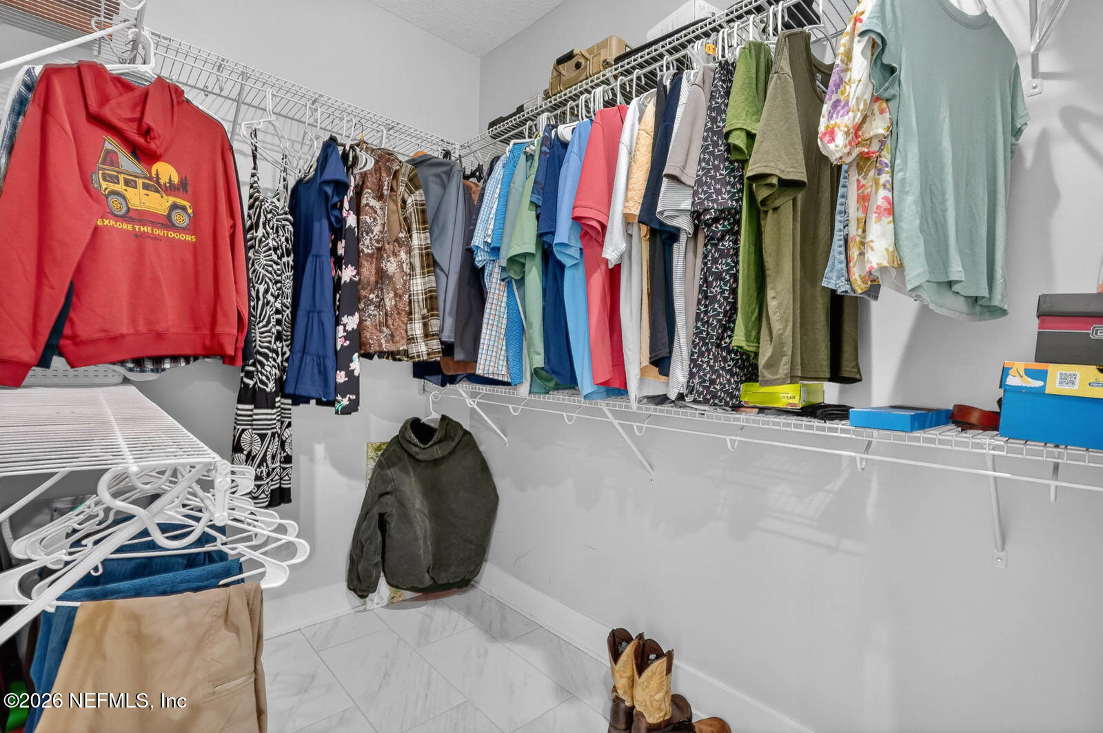 264 Peniel Church Road Palatka, FL 32177 - Photo 24 of 48 a view of walk in closet with clothes