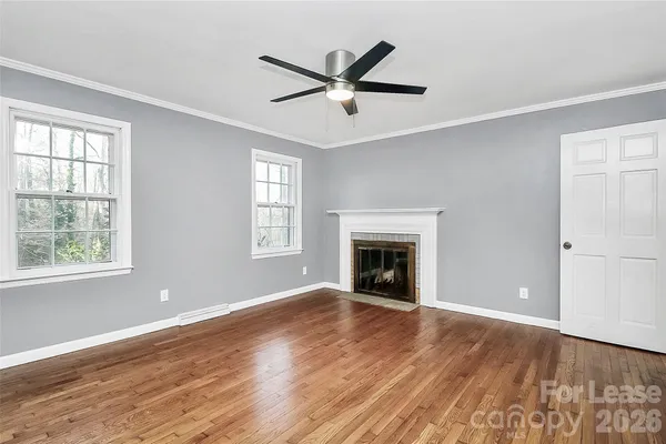 wooden floor and a bathroom with a toilet