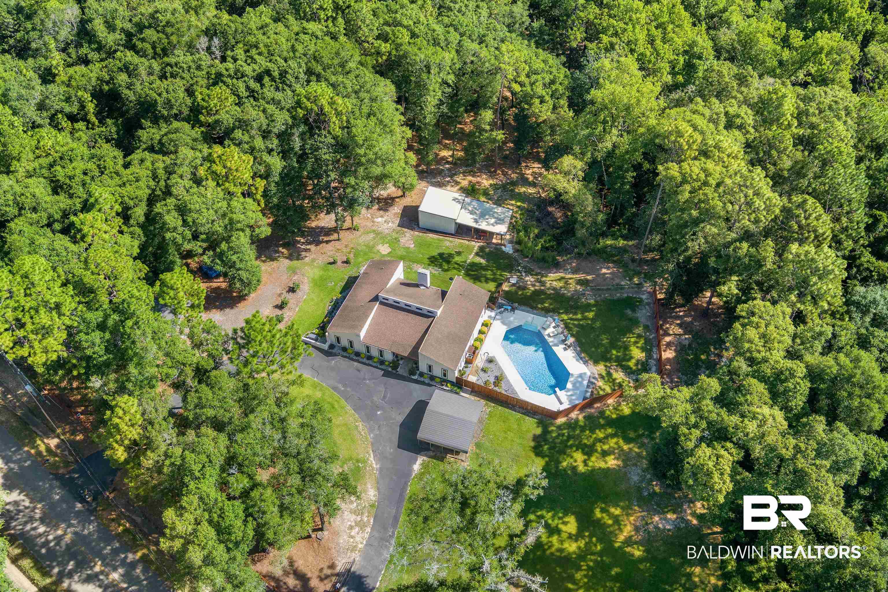 7912 Yorkhaven Road Mobile, AL 36695 - Photo 37 of 41 Aerial view of property and surrounding area with a pool area