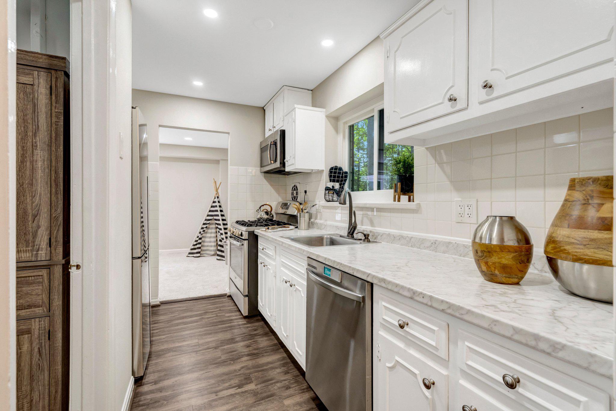 8213 Springfield Village Drive Springfield, VA 22152 - Photo 8 of 25 Bright Kitchen with Stainless steel appliances