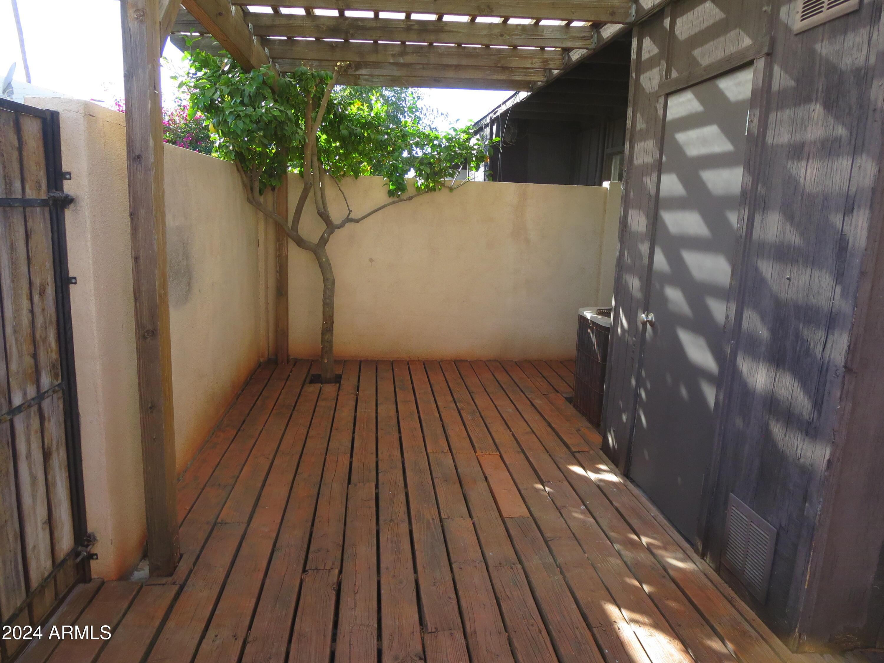 1450 East Bethany Home Road, Unit 34 Phoenix, AZ 85014 - Photo 14 of 15 a view of backyard with a deck