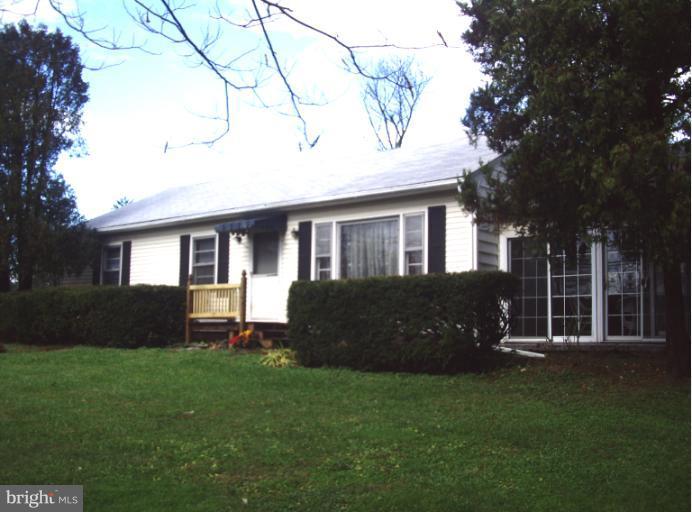 13840 Penn Shop Road Mount Airy, MD 21771 - Photo 26 of 29 a front view of a house with a garden