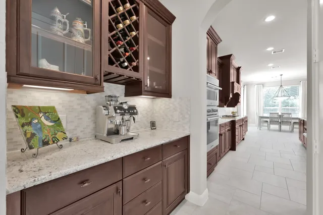a spacious bathroom with a double vanity sink a mirror and a shower