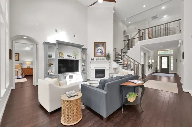a living room with fireplace furniture and a flat screen tv