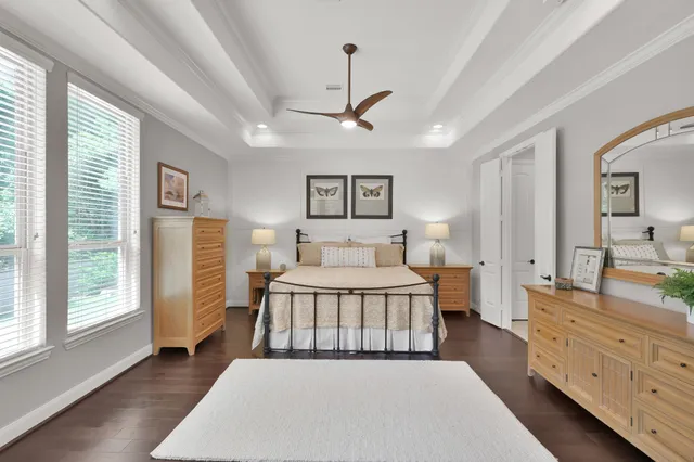 a bed room with a bed and a dresser