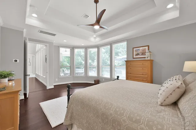 a bed room with a bed and a night stand