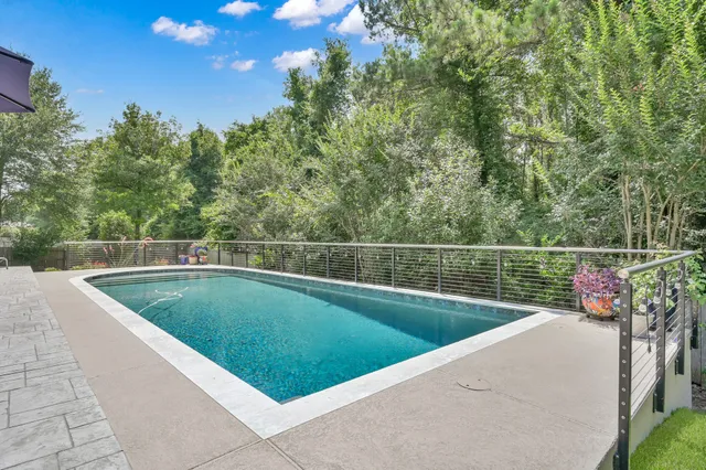 a view of a swimming pool with a garden