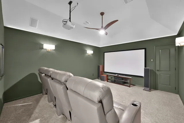 a room with pool table and windows