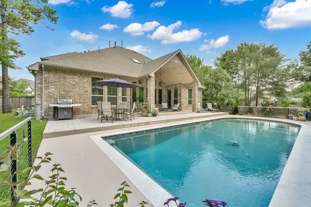 a view of a chair and table of the house