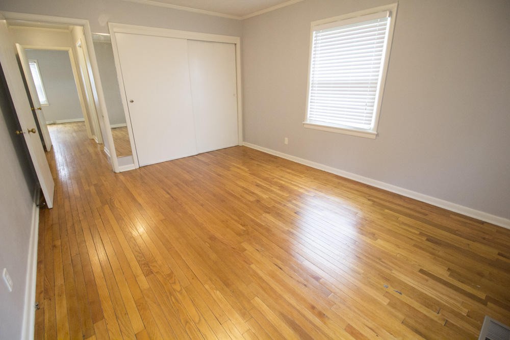 630 Robertsville Road Oak Ridge, TN 37830 - Photo 16 of 21 a view of an empty room with wooden floor and a window
