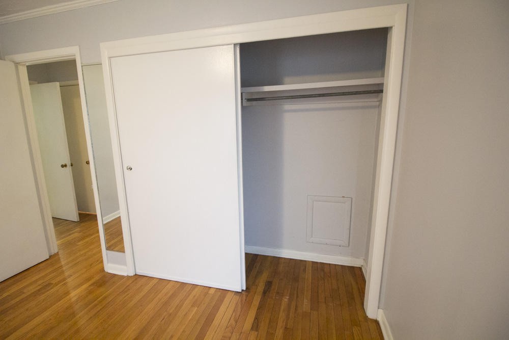 630 Robertsville Road Oak Ridge, TN 37830 - Photo 17 of 21 a view of an empty room with wooden floor and a hallway