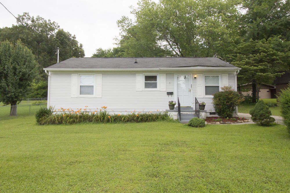 630 Robertsville Road Oak Ridge, TN 37830 - Photo 2 of 21 a view of a house with backyard and garden