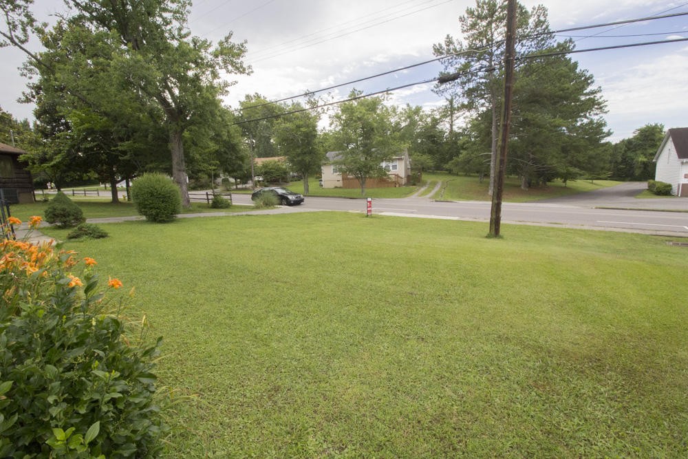 630 Robertsville Road Oak Ridge, TN 37830 - Photo 3 of 21 a view of yard with swimming pool and trees