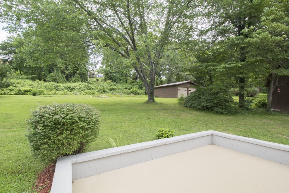 630 Robertsville Road Oak Ridge, TN 37830 - Photo 9 of 21 a view of a backyard with large trees