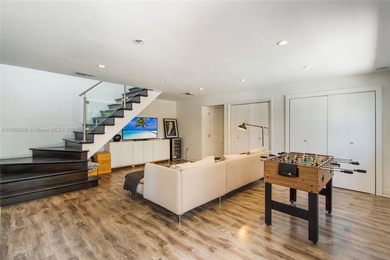 1701 Micanopy Avenue Miami, FL 33133 - Photo 12 of 40 a living room with furniture and wooden floor
