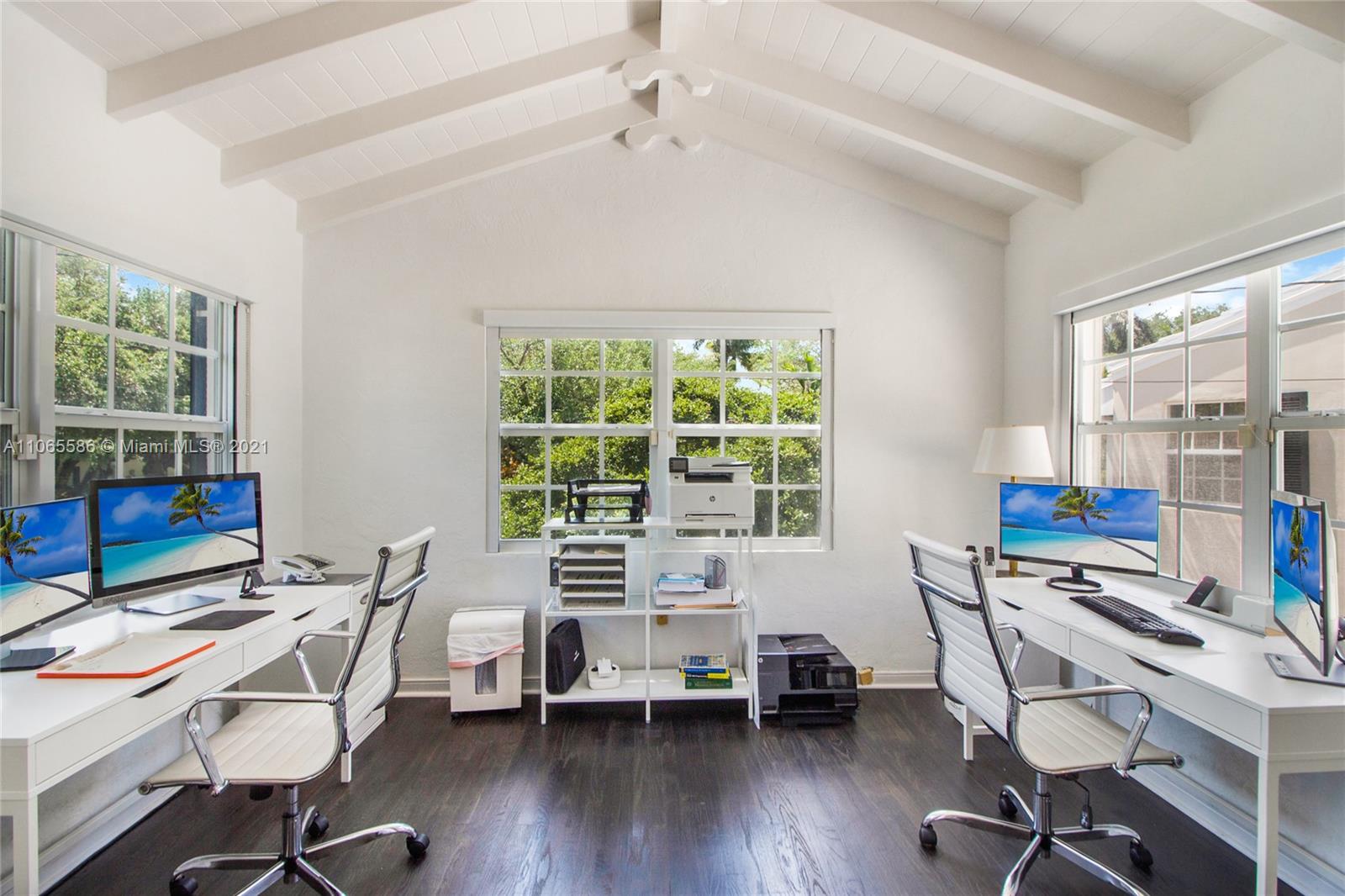 1701 Micanopy Avenue Miami, FL 33133 - Photo 23 of 40 a workspace with furniture and a window