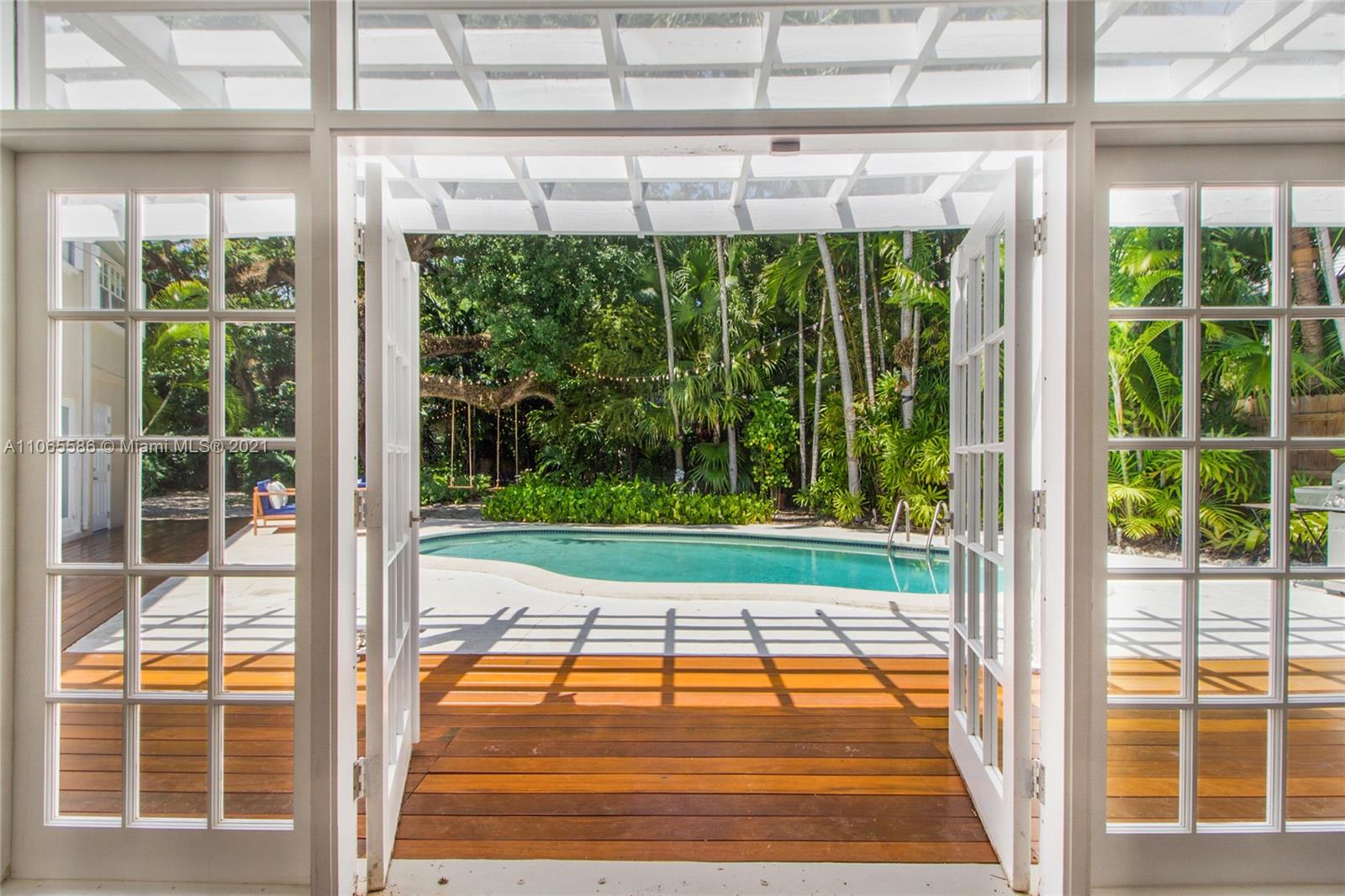 1701 Micanopy Avenue Miami, FL 33133 - Photo 28 of 40 a view of porch with a backyard