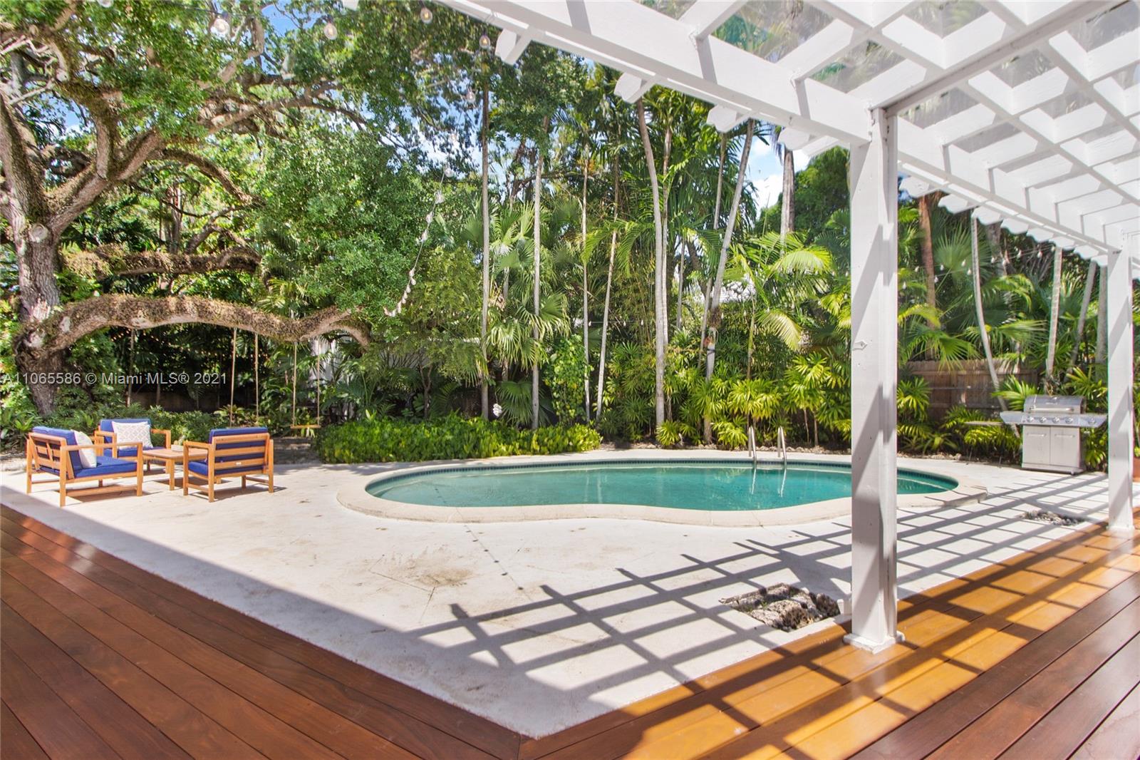 1701 Micanopy Avenue Miami, FL 33133 - Photo 32 of 40 a view of a backyard with sitting area