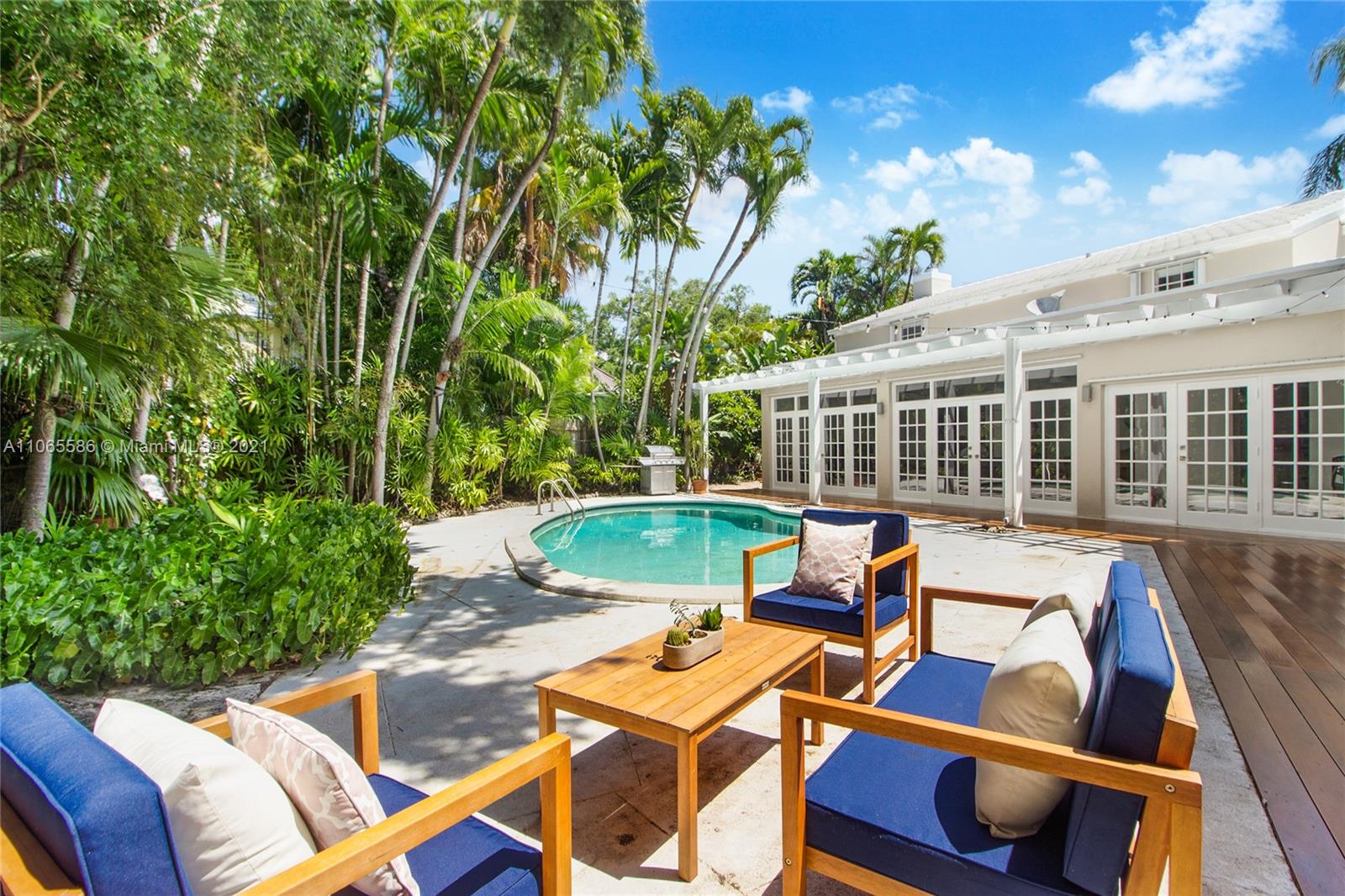 1701 Micanopy Avenue Miami, FL 33133 - Photo 34 of 40 a view of a patio with chairs and tables