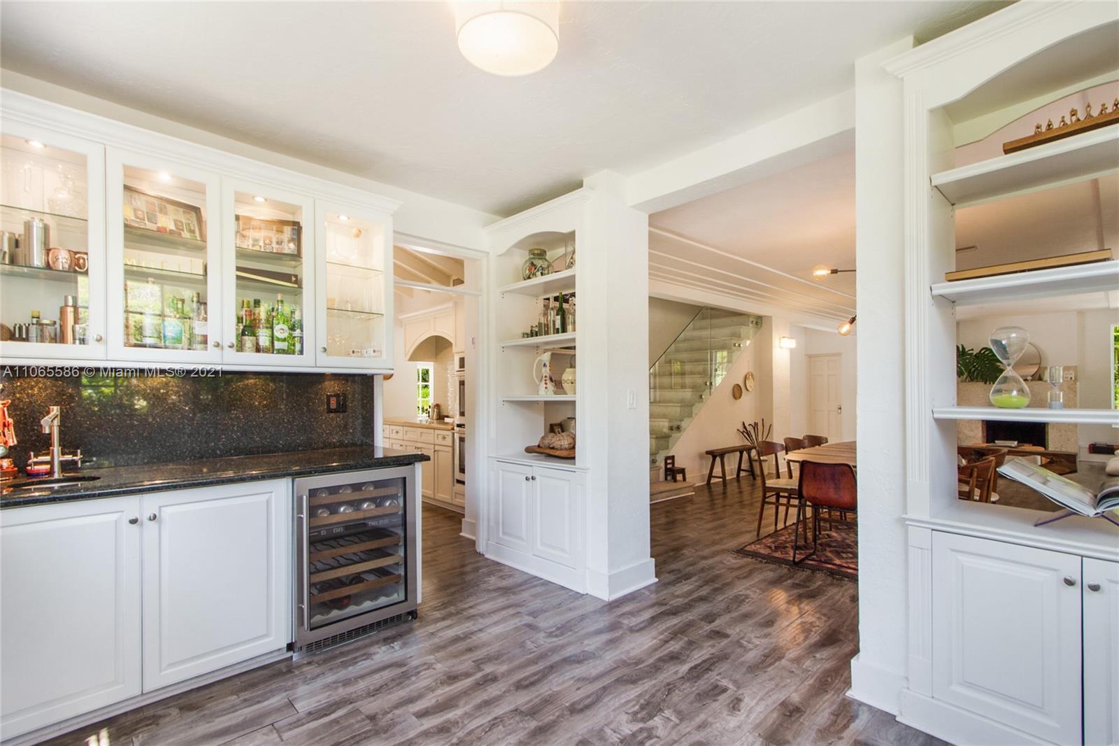 1701 Micanopy Avenue Miami, FL 33133 - Photo 39 of 40 a kitchen with a sink and wooden floor