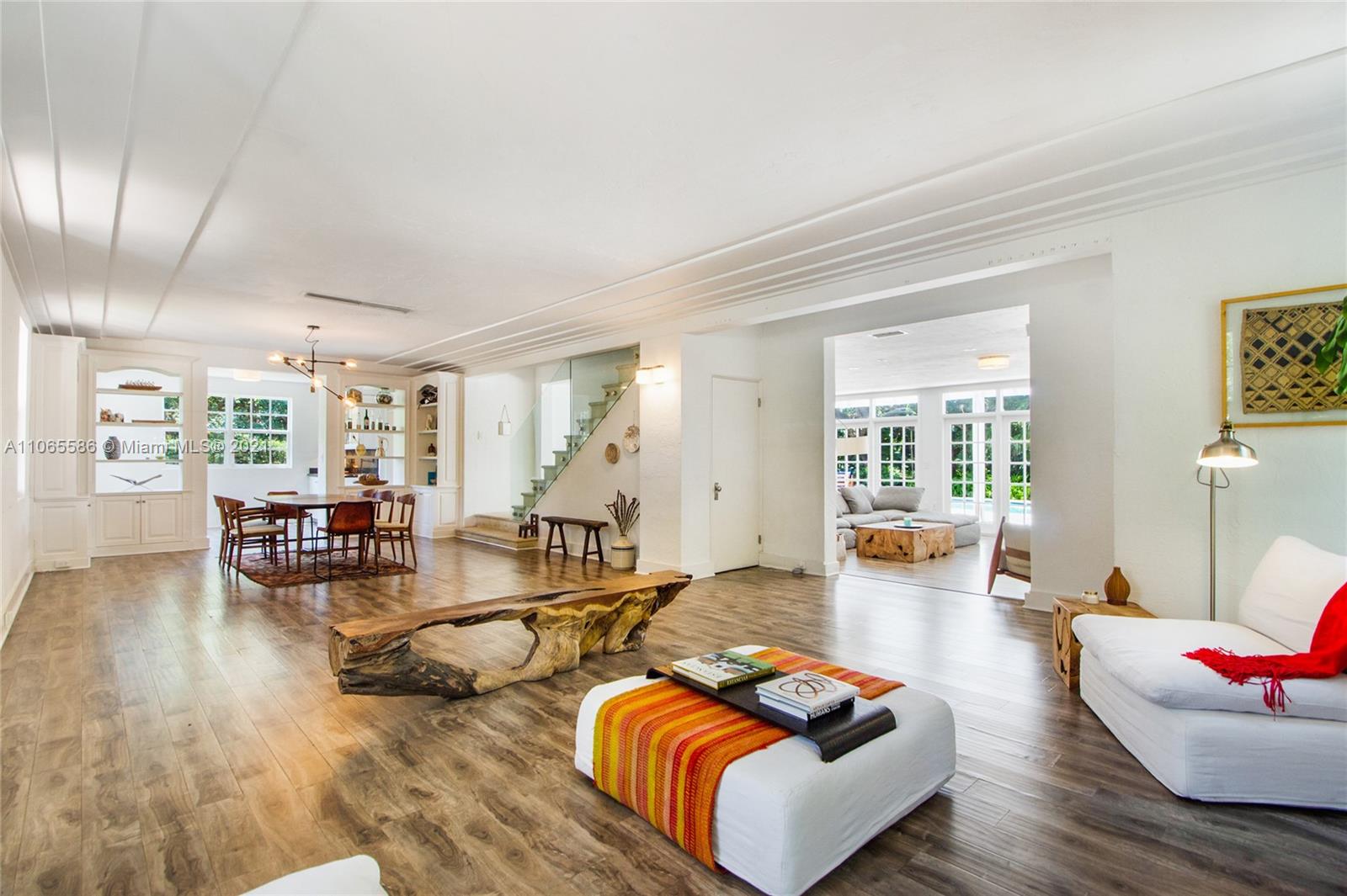 1701 Micanopy Avenue Miami, FL 33133 - Photo 5 of 40 a living room with furniture and wooden floor