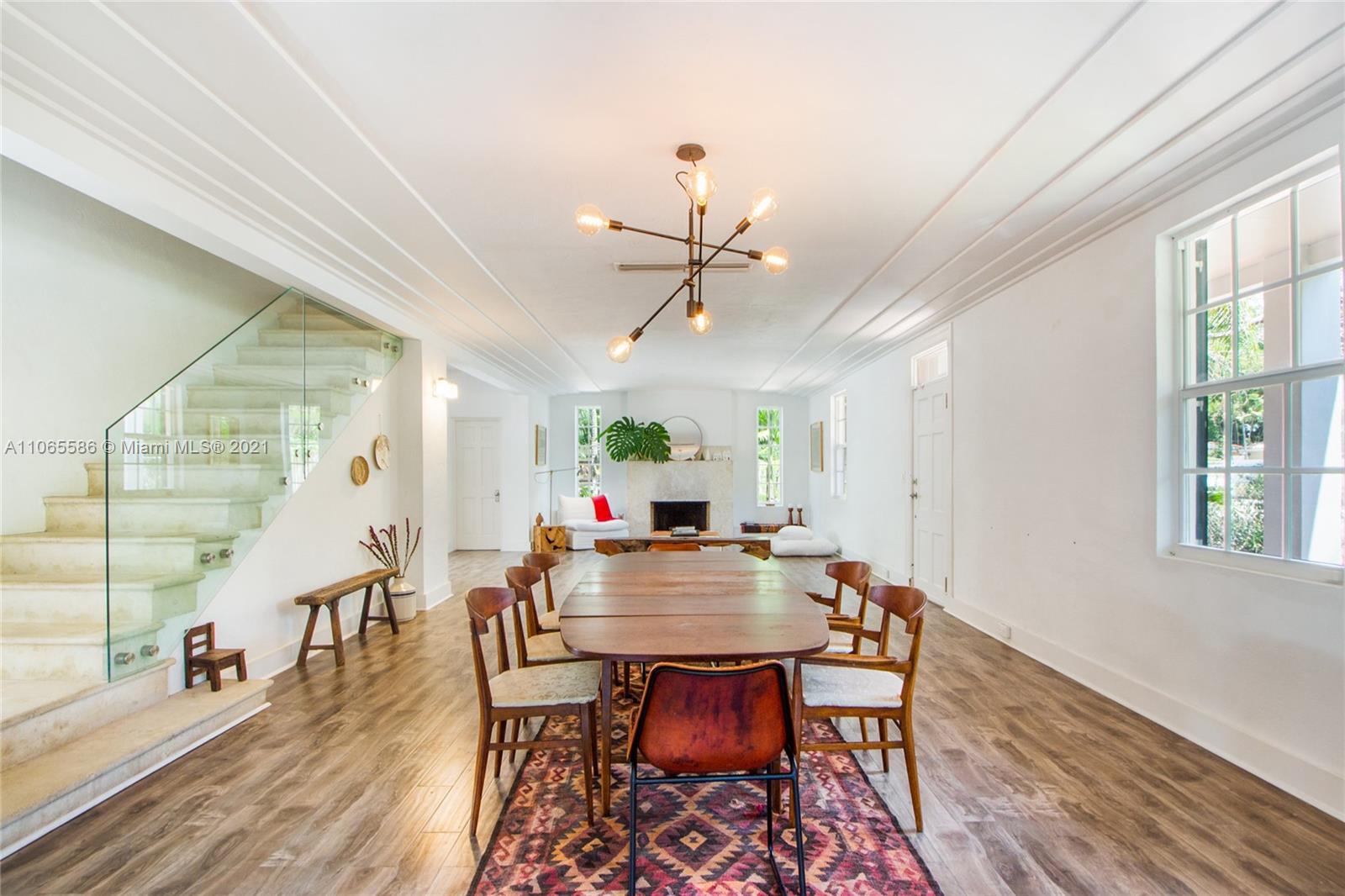 1701 Micanopy Avenue Miami, FL 33133 - Photo 6 of 40 a view of a dining room with furniture window and wooden floor
