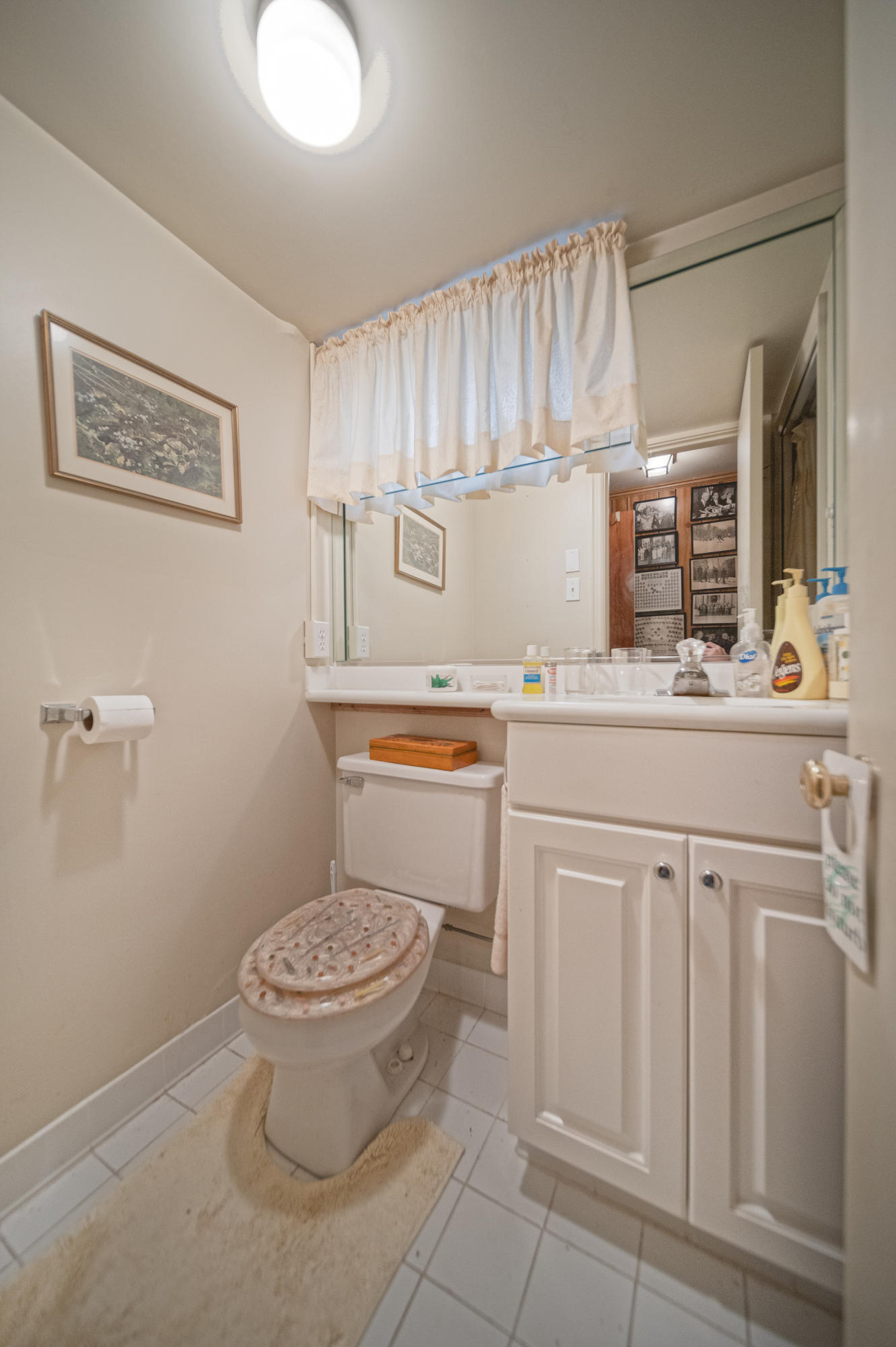 3173 Stoneridge Road Southwest Roanoke, VA 24014 - Photo 11 of 31 a bathroom with a toilet a sink and a mirror