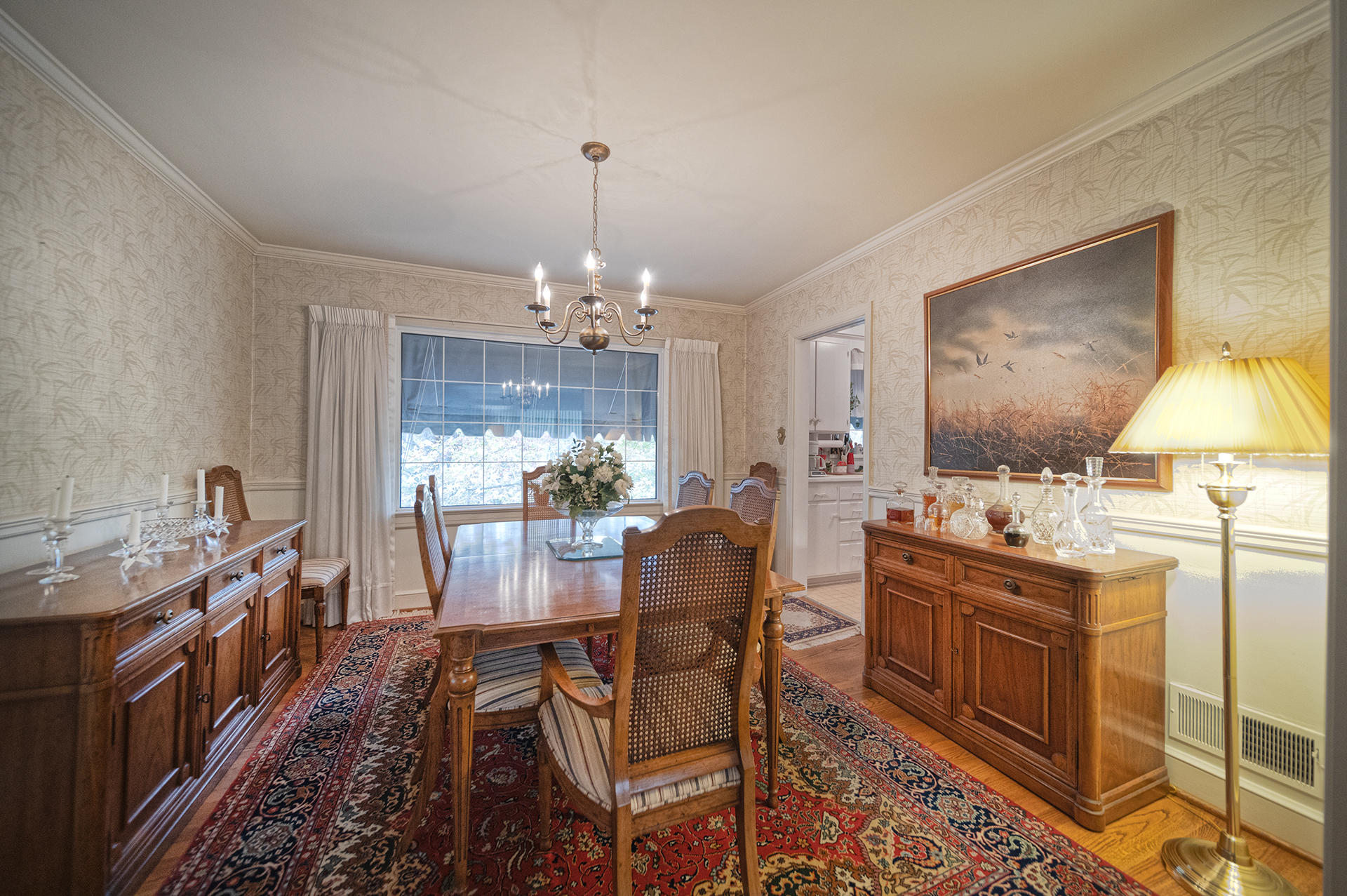 3173 Stoneridge Road Southwest Roanoke, VA 24014 - Photo 12 of 31 a view of a dining room with furniture and chandelier
