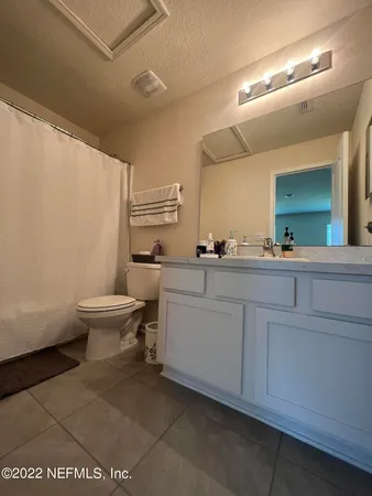 a room with a sink and a toilet